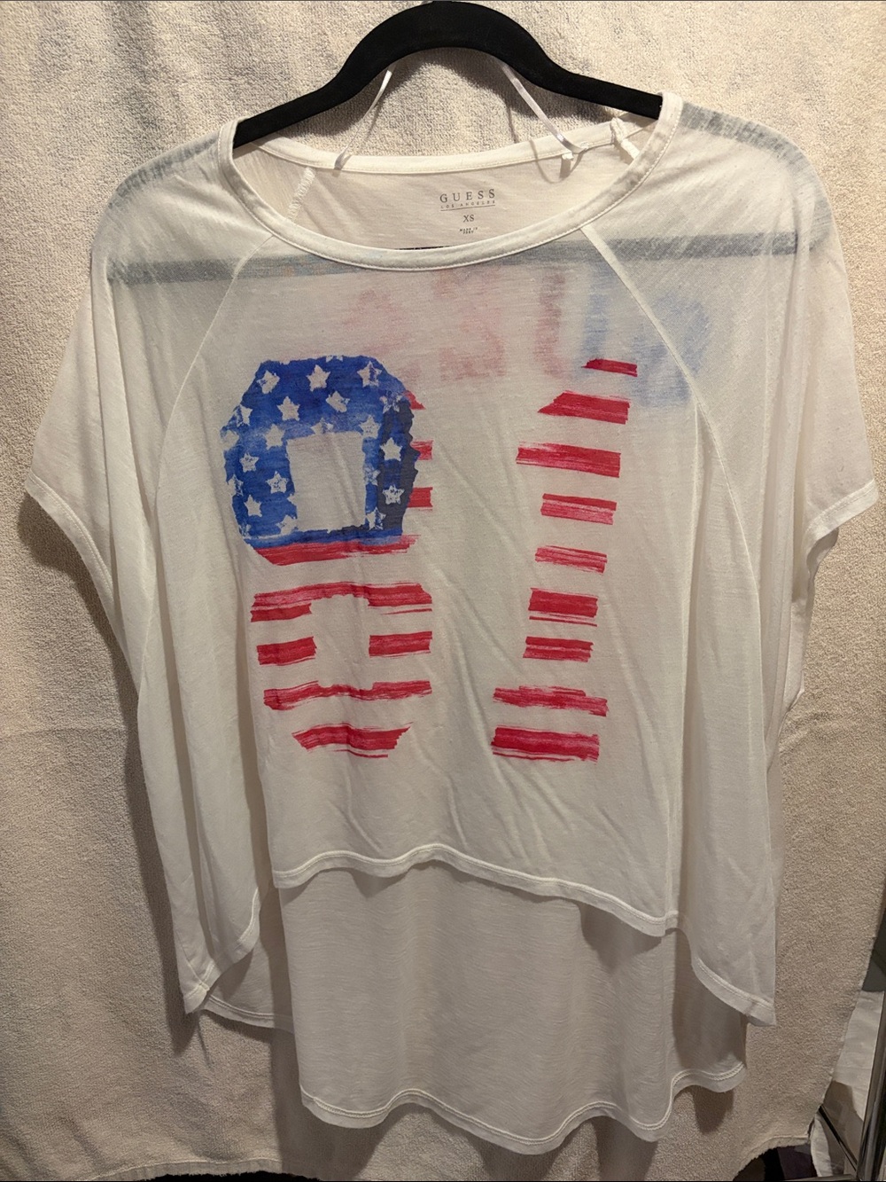 GUESS White Sheer Tunic with Red and Blue Flag Graphic